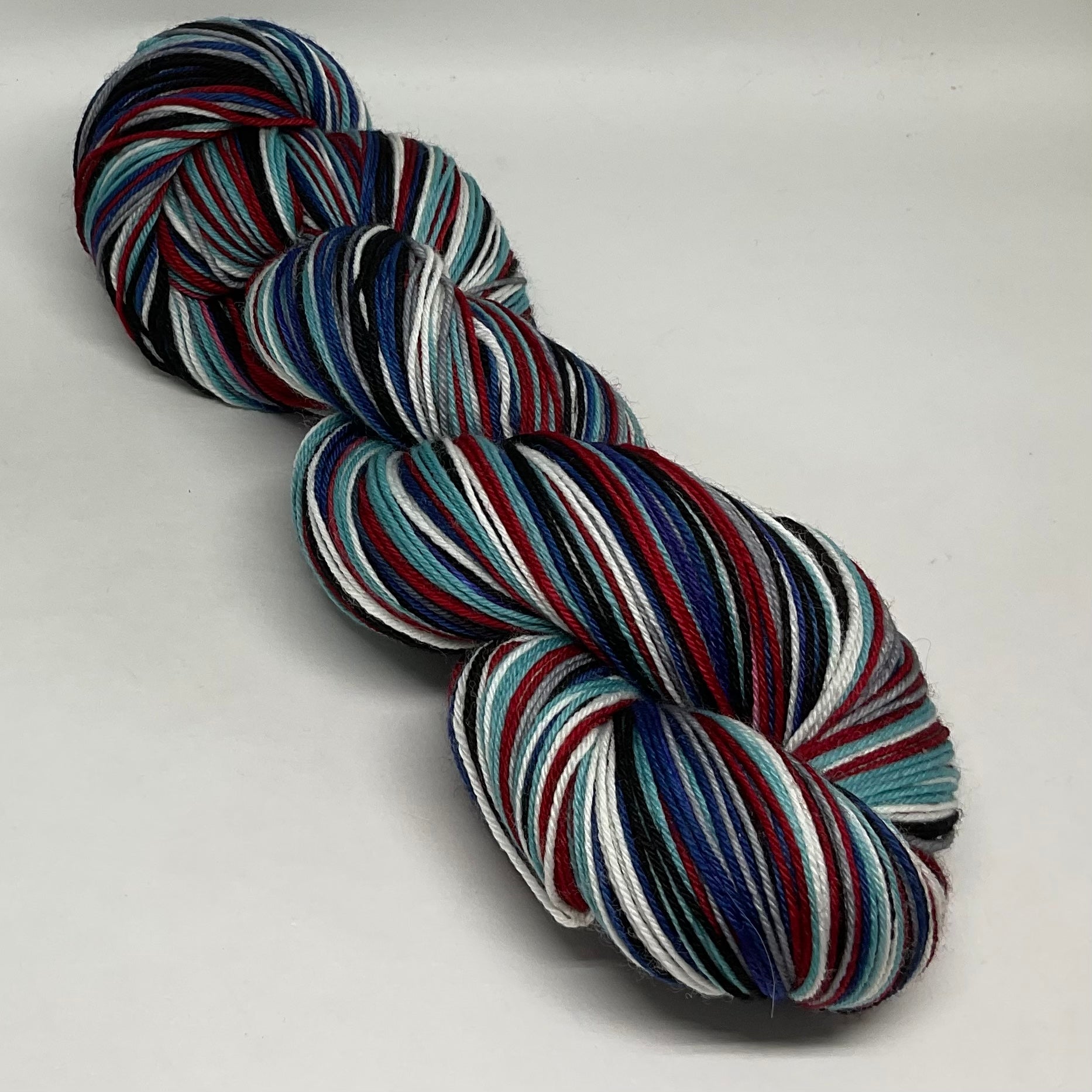 Treat People with Kindness Six Stripe Self Striping Sock Yarn with Coo -  Desert Vista Dyeworks